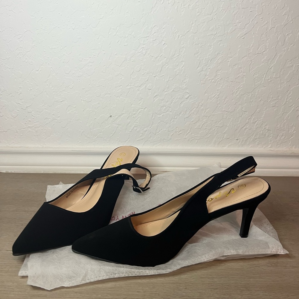 Black suede point toed heels